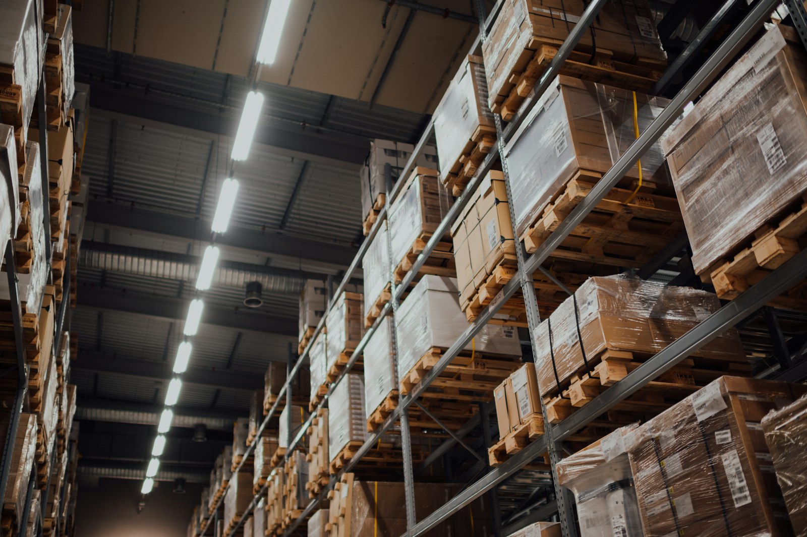 Racked warehouse pallets and cartons staged for order fulfillment